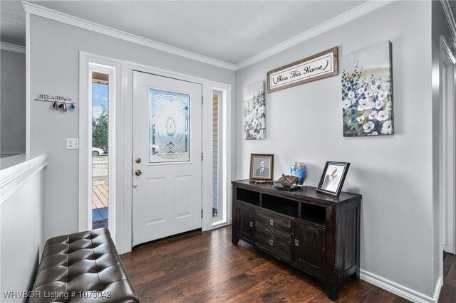 entryway with dark hardwood / wood-style flooring and crown molding