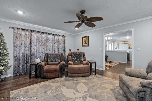 living room with a textured ceiling, crown molding, dark hardwood / wood-style floors, and ceiling fan with notable chandelier