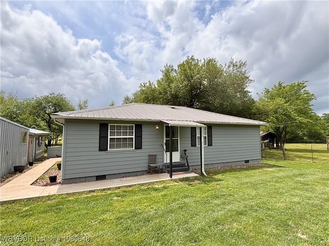 4245 W Piney Mountain Rd, Waldron, AR 72958 - view of front of property with entry steps, metal roof, a front lawn, and crawl space