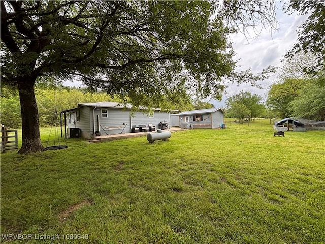 4245 W Piney Mountain Rd, Waldron, AR 72958 - view of yard with an outdoor structure, central air condition unit, and fence