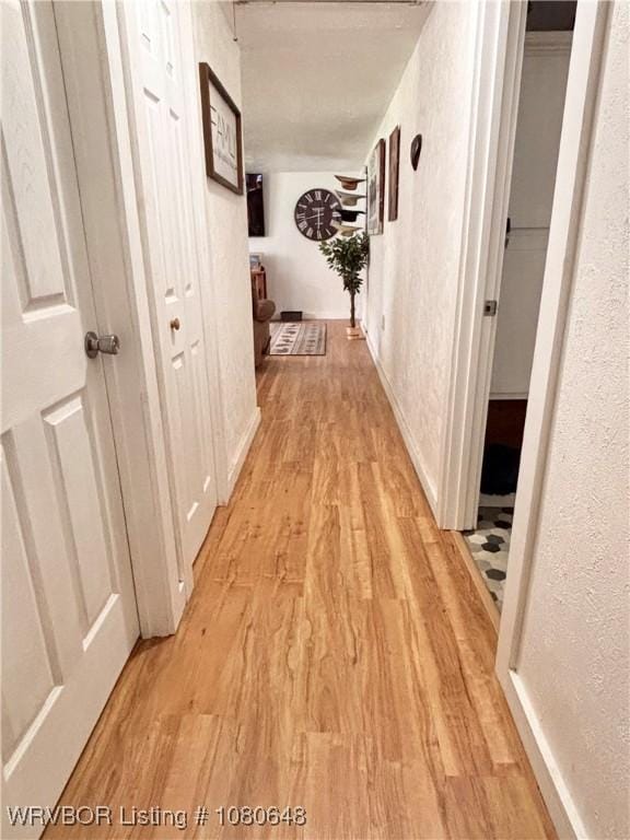 4245 W Piney Mountain Rd, Waldron, AR 72958 - hallway featuring light wood finished floors