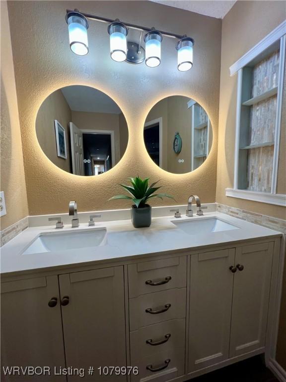 2205 Crosshill Rd, Fort Smith, AR 72908 - bathroom with a textured wall and double vanity