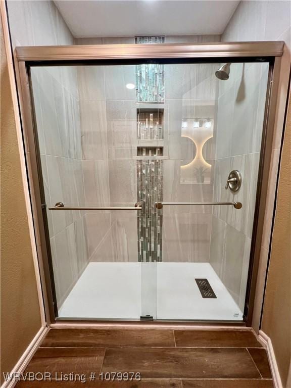 2205 Crosshill Rd, Fort Smith, AR 72908 - bathroom featuring a stall shower and wood finished floors