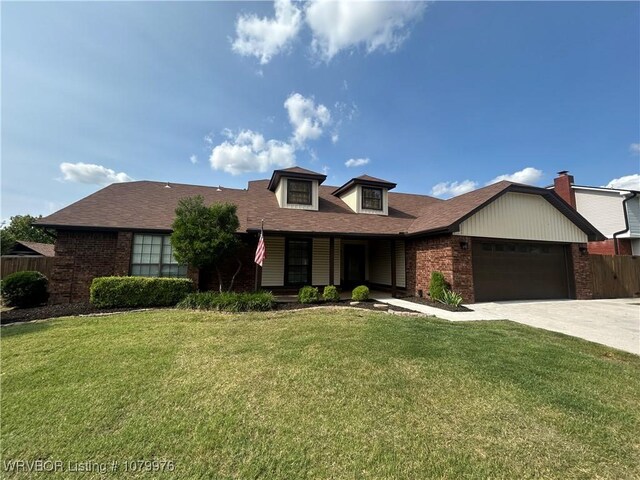 2205 Crosshill Rd, Fort Smith, AR 72908 - view of front of property featuring brick siding, an attached garage, concrete driveway, and roof with shingles