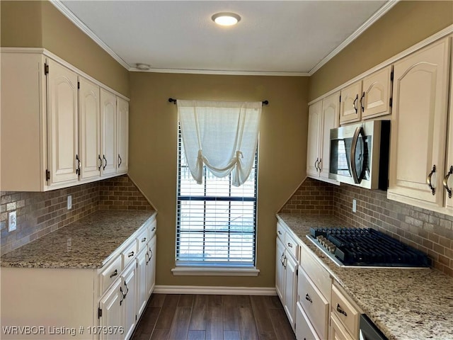 2205 Crosshill Rd, Fort Smith, AR 72908 - kitchen featuring gas cooktop, stainless steel microwave, dark wood-style flooring, backsplash, and crown molding