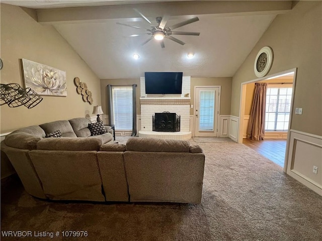 2205 Crosshill Rd, Fort Smith, AR 72908 - carpeted living room featuring a ceiling fan, wainscoting, a fireplace, and a decorative wall