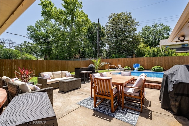 7118 S T St, Fort Smith, AR 72903 - view of patio / terrace featuring outdoor dining area, an outdoor hangout area, a fenced backyard, and area for grilling