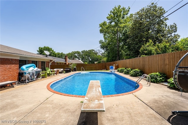 7118 S T St, Fort Smith, AR 72903 - view of swimming pool with a fenced backyard, a patio, and a diving board
