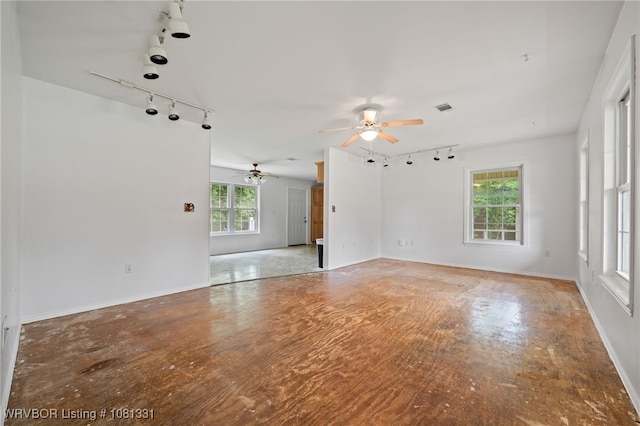 505 7th St, Barling, AR 72923 - unfurnished living room with rail lighting, ceiling fan, and baseboards