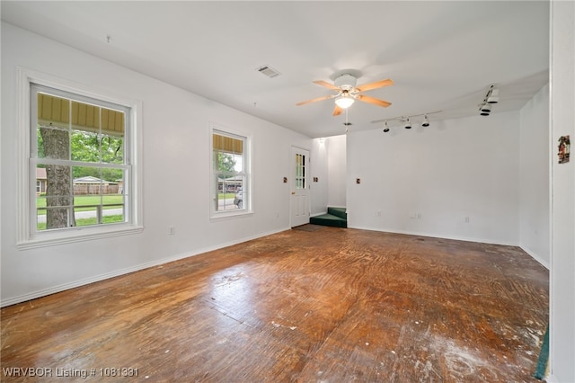 505 7th St, Barling, AR 72923 - empty room featuring track lighting, ceiling fan, and baseboards