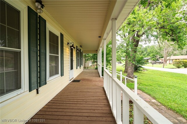 505 7th St, Barling, AR 72923 - wooden porch with a yard
