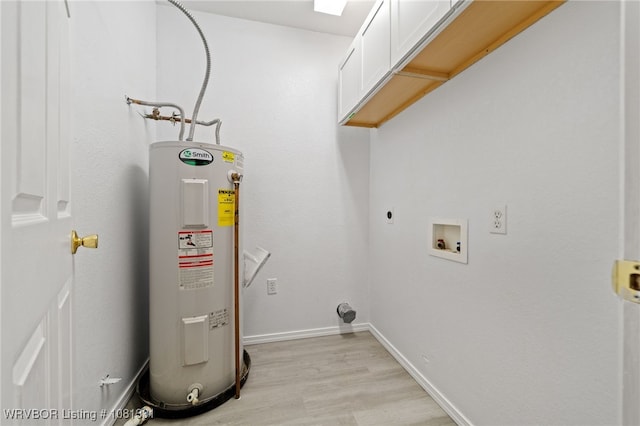 505 7th St, Barling, AR 72923 - laundry area with electric water heater, electric dryer hookup, cabinet space, light wood-type flooring, and baseboards