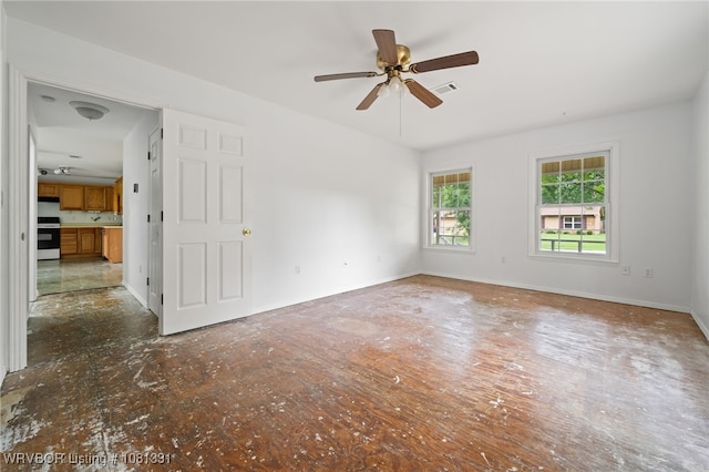 505 7th St, Barling, AR 72923 - empty room featuring a ceiling fan and baseboards