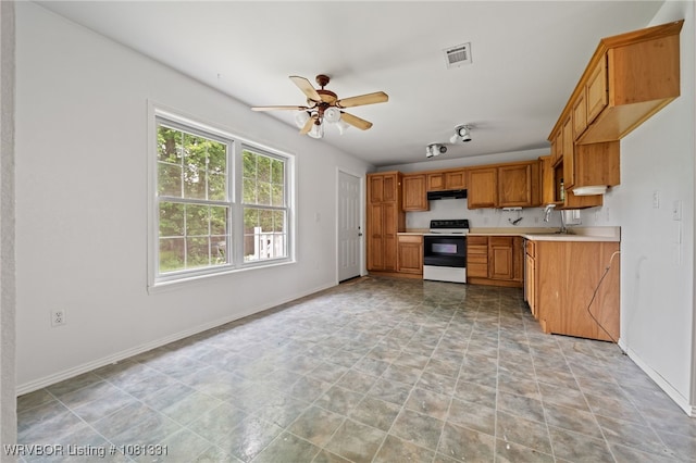 505 7th St, Barling, AR 72923 - kitchen featuring electric range, a ceiling fan, light countertops, and baseboards