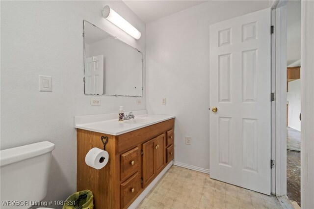 505 7th St, Barling, AR 72923 - bathroom featuring vanity, toilet, and tile patterned floors