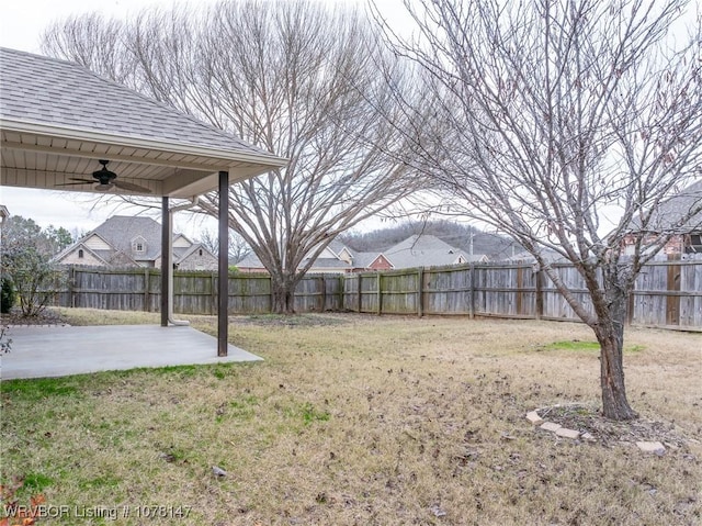 view of yard with a patio area and ceiling fan