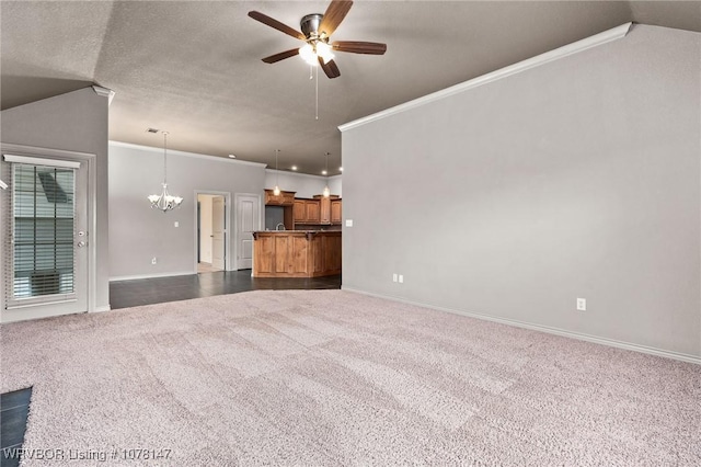 unfurnished living room with crown molding, ceiling fan with notable chandelier, and dark colored carpet