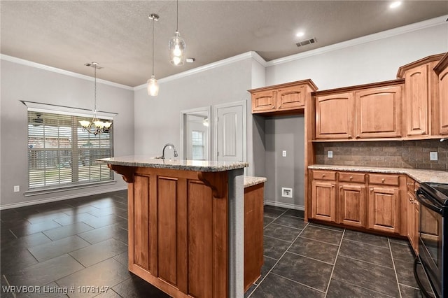 kitchen with decorative backsplash, a center island with sink, electric range, and hanging light fixtures