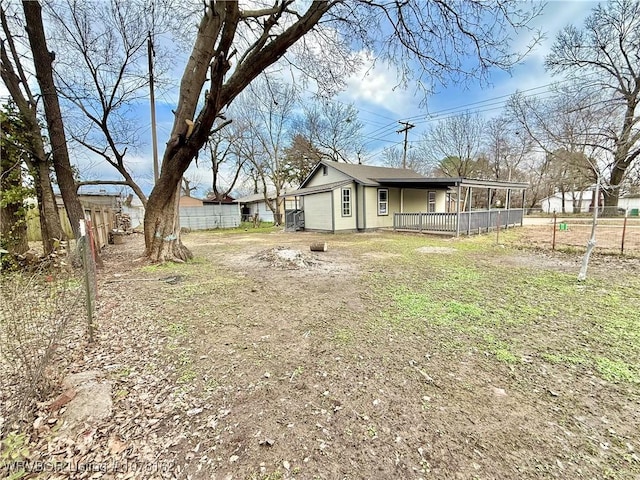 view of yard featuring a garage and a wooden deck