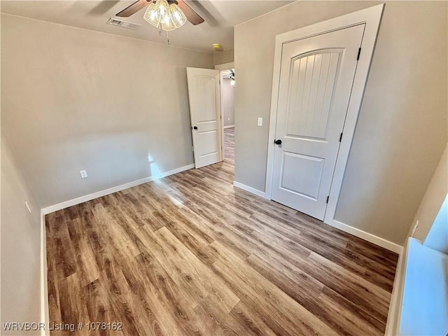 unfurnished bedroom with light hardwood / wood-style flooring and ceiling fan