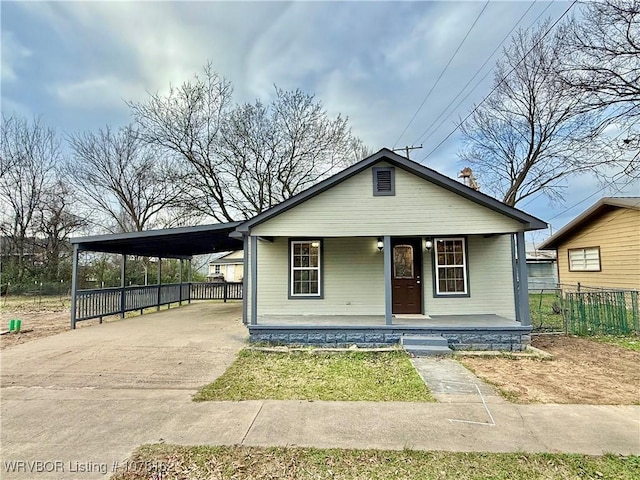 view of front facade featuring a carport and a porch