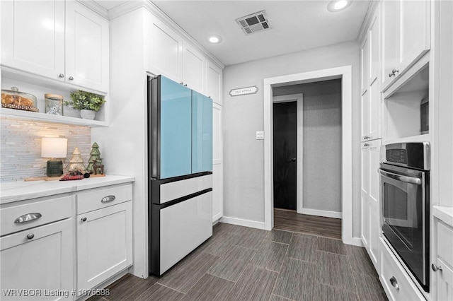 kitchen with white cabinets and appliances with stainless steel finishes