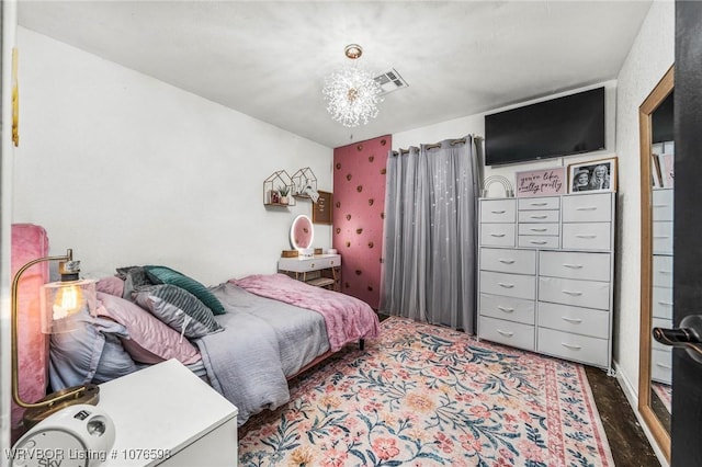 bedroom with an inviting chandelier