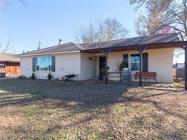 ranch-style home with a front lawn