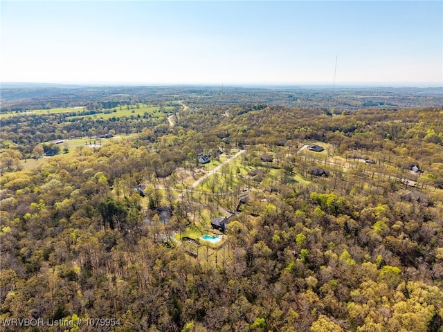 aerial view featuring a wooded view