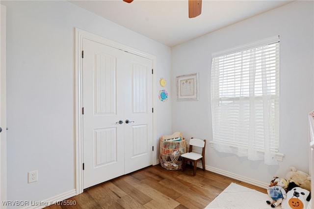 interior space featuring light wood-type flooring, a closet, and ceiling fan