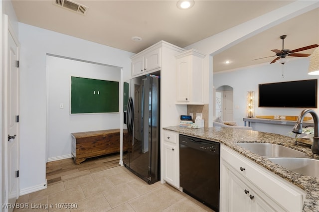 kitchen featuring light stone countertops, white cabinetry, sink, ceiling fan, and black appliances