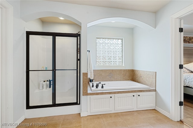 bathroom with plus walk in shower and tile patterned floors