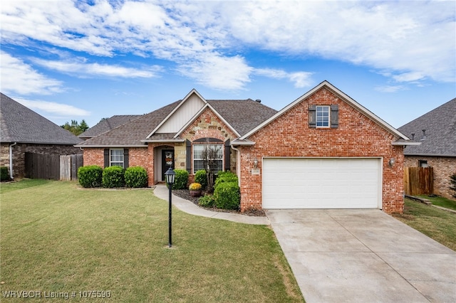 view of front of house featuring a garage and a front yard