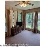 700 Timber Ridge Rd, Howe, OK 74937 - living area featuring ceiling fan and carpet floors