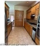 700 Timber Ridge Rd, Howe, OK 74937 - kitchen with brown cabinets and under cabinet range hood