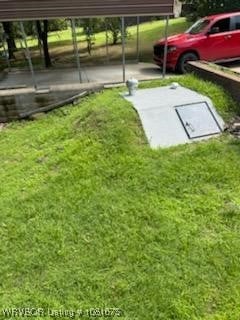 700 Timber Ridge Rd, Howe, OK 74937 - view of storm shelter with a lawn