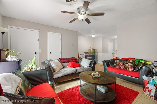 living room with light tile patterned floors and ceiling fan