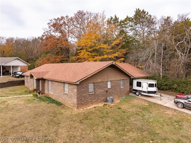 view of side of home featuring a yard