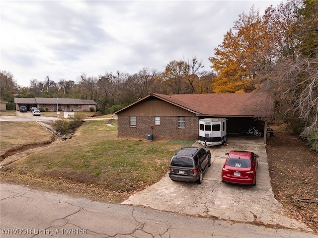 view of front of property featuring central air condition unit and a front lawn