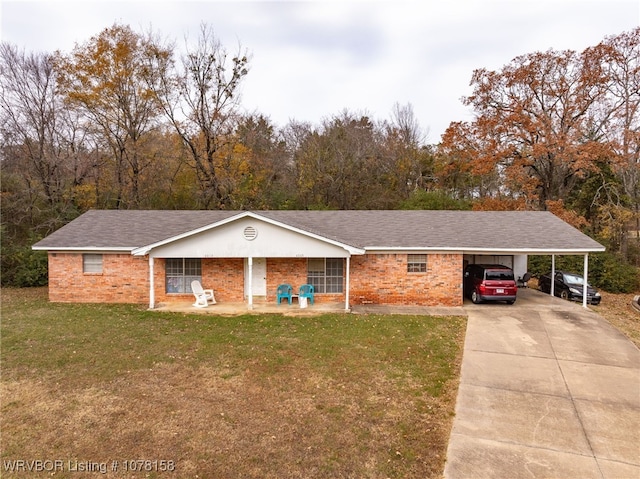 ranch-style house featuring a front yard and a carport