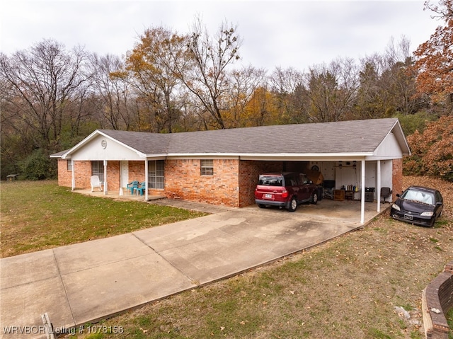 ranch-style home with a carport and a front lawn