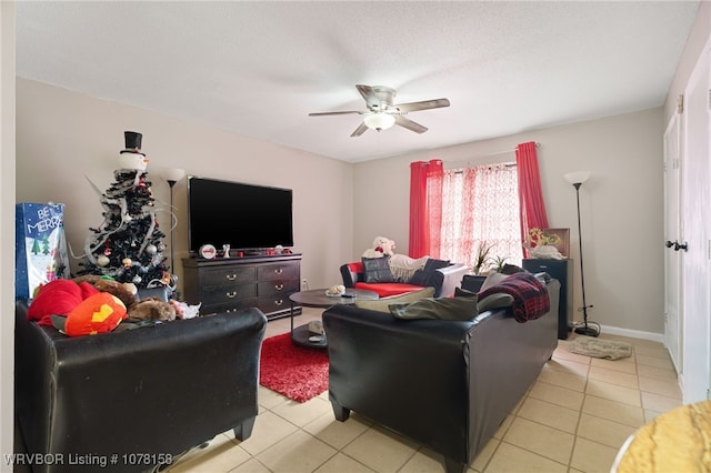 tiled living room with ceiling fan and a textured ceiling