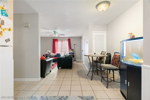 interior space featuring ceiling fan and light tile patterned floors