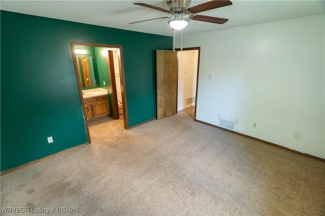 8617 S 15th St, Fort Smith, AR 72908 - unfurnished bedroom featuring light colored carpet, connected bathroom, and a ceiling fan