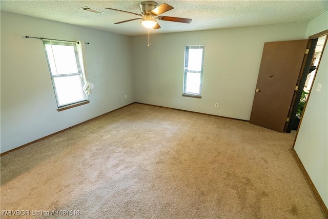8617 S 15th St, Fort Smith, AR 72908 - carpeted spare room with ceiling fan and a textured ceiling