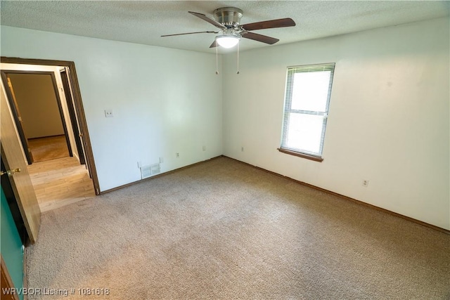 8617 S 15th St, Fort Smith, AR 72908 - spare room featuring carpet, a ceiling fan, and a textured ceiling