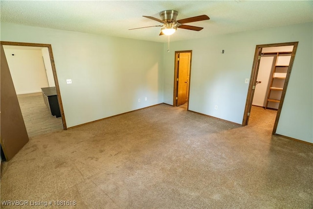 8617 S 15th St, Fort Smith, AR 72908 - unfurnished bedroom featuring a spacious closet, carpet flooring, and a ceiling fan