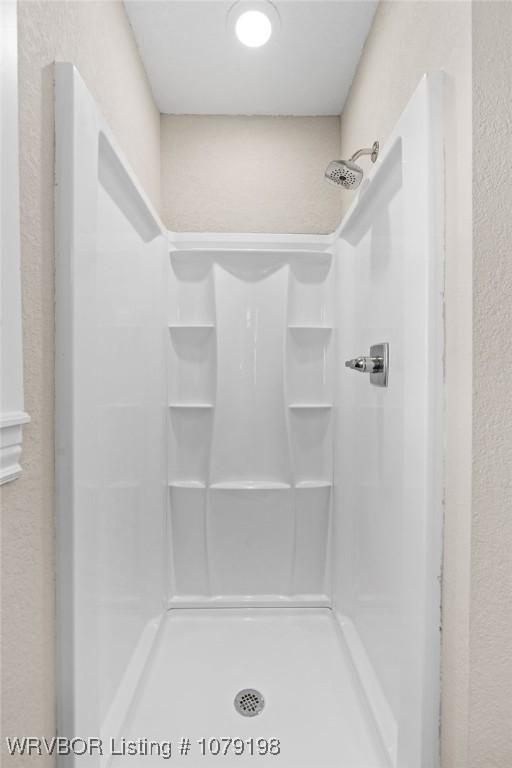 bathroom with a stall shower