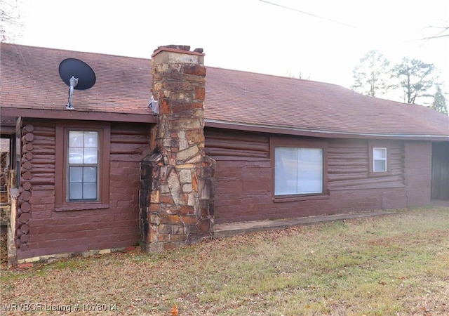 view of home's exterior featuring a yard