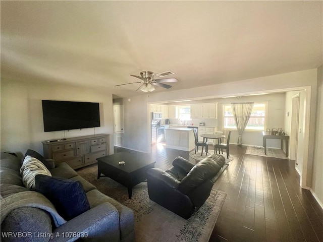 living room with hardwood / wood-style floors and ceiling fan